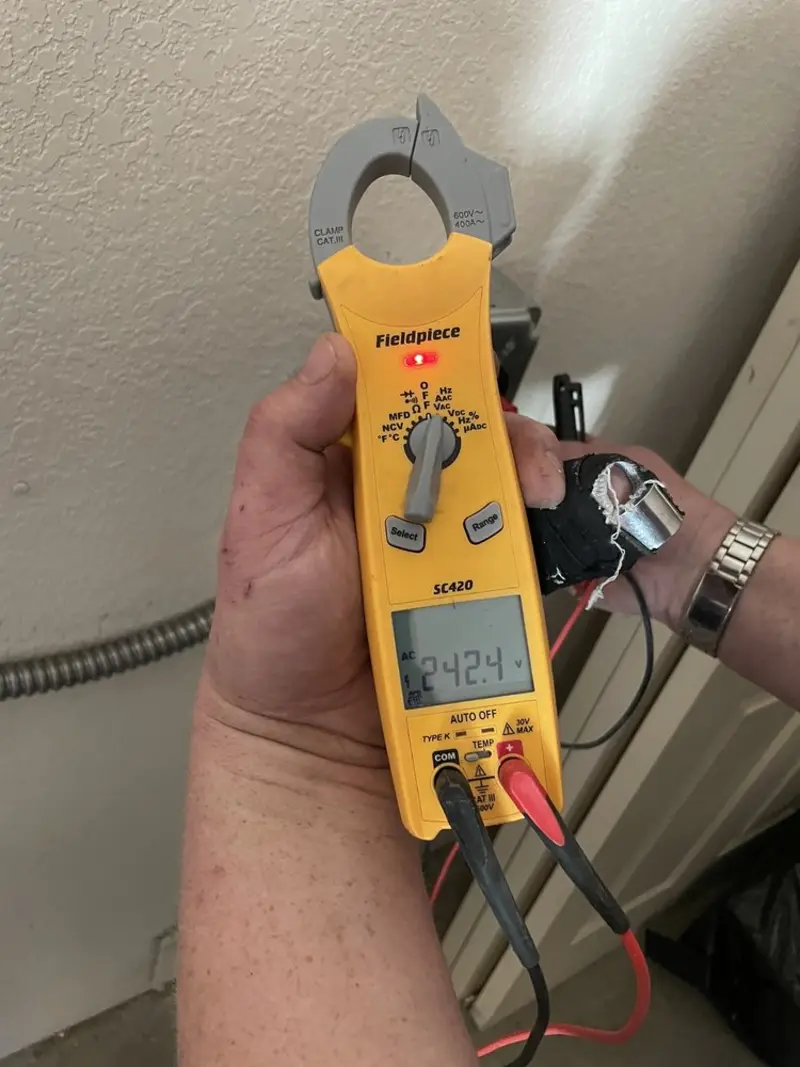 Voltage testing with clamp meter during Ceiling Fan Installation in Woodlawn